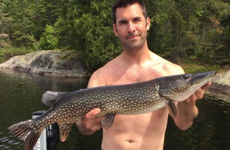 Happy Guest Holding Northern Pike